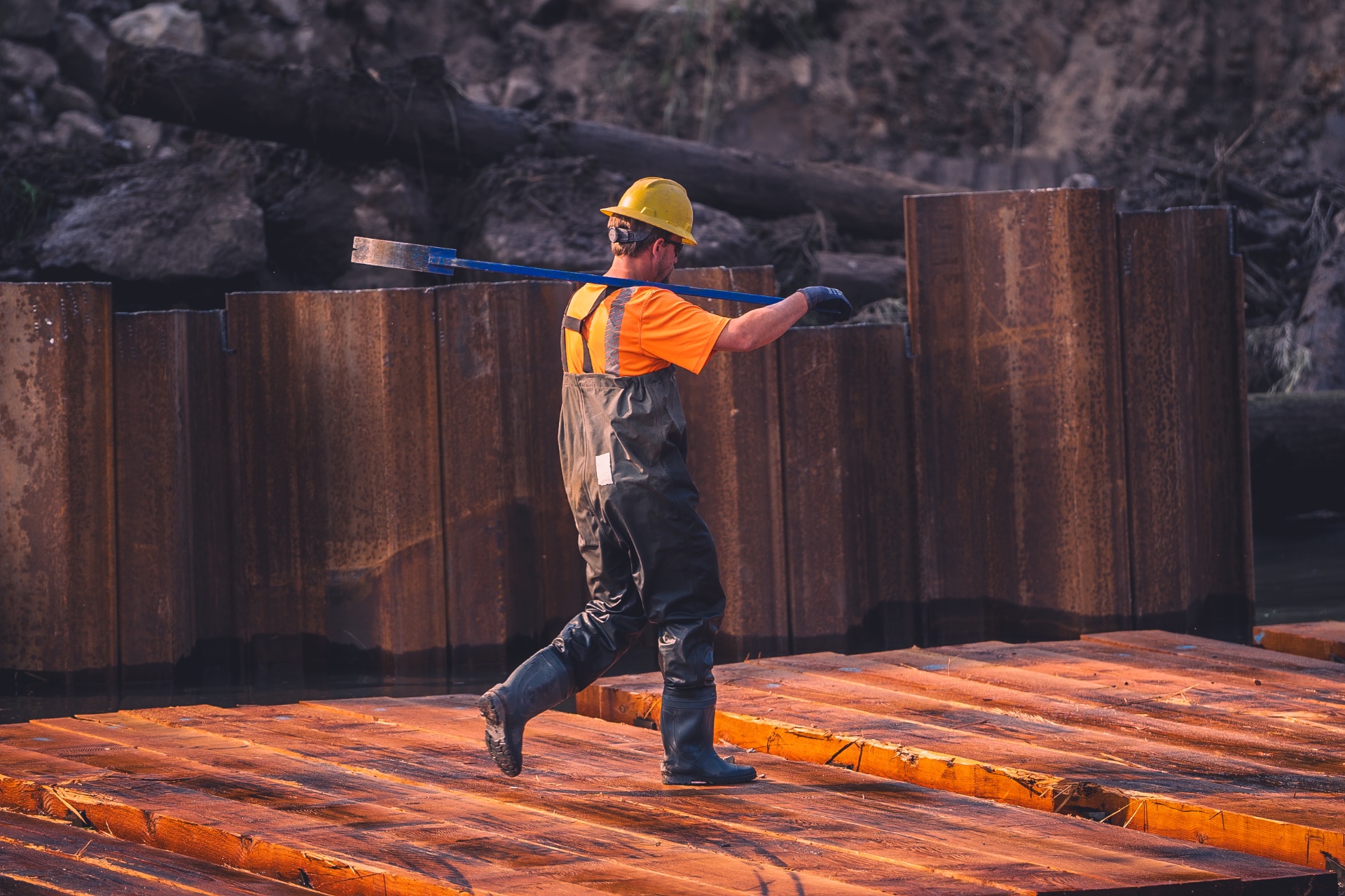 Worker in waders on marine construction site